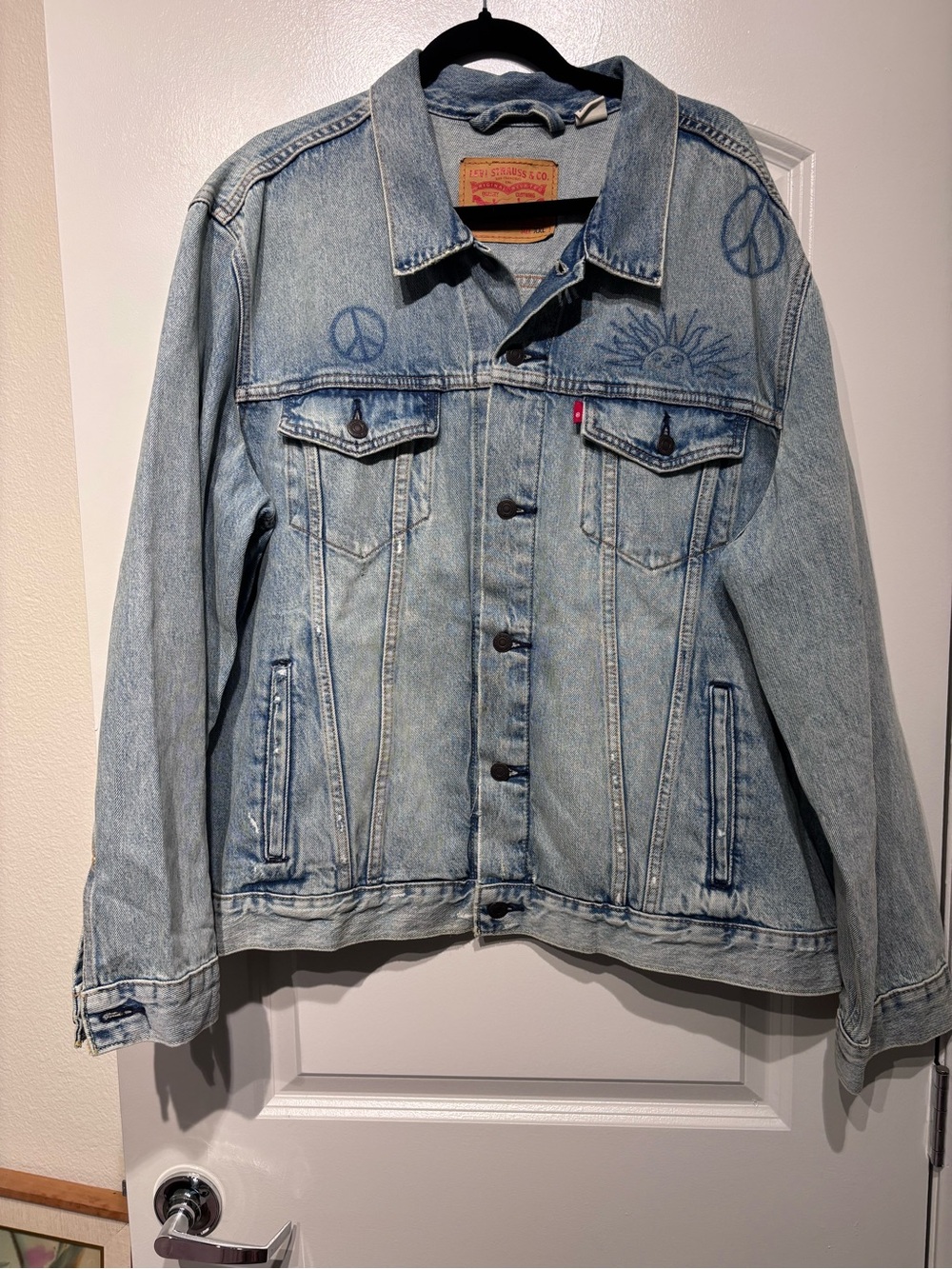 Levi's Light Blue Denim Trucker Jacket with Peace & Sun Motifs